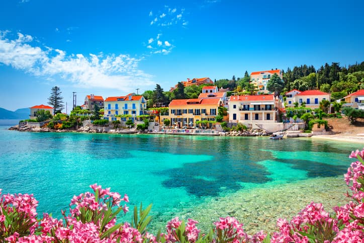 The fishing village of Fiskardo Kefalonia blue sea and sky with buildings and boats